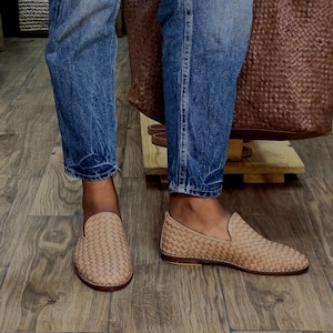 Handmade men’s braided leather shoes featuring a woven design and classic driving moccasin style. These leather loafers offer a comfortable, flexible fit ideal for weddings, groom fashion, and stylish everyday wear. Crafted with detailed braided texture for a refined, elegant look that complements both formal and casual outfits.