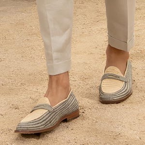 Handmade men’s raffia wedding shoes featuring natural woven fibers and a lightweight loafer design. Perfect for grooms seeking unique, stylish footwear for beach, boho, or summer ceremonies. Comfortable, breathable, and crafted with detailed handwoven texture for an elegant, natural look.