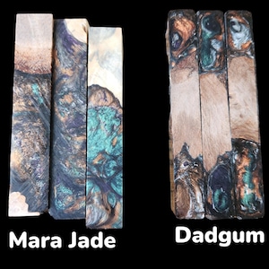 May include: Two sets of wooden blanks for crafting. The first set is called "Mara Jade" and features a blue, green, and brown marbled pattern. The second set is called "Dadgum" and features a brown, green, and copper marbled pattern.