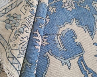 Modern oushak hand knotted wool rug in cream and blue color for living room and home decor.