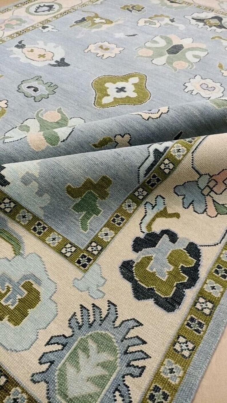 Soft Blue and Beige with olive green accent floral design oushak hand knotted wool rug for living room and home decor in 8x10,9x12 sizes.