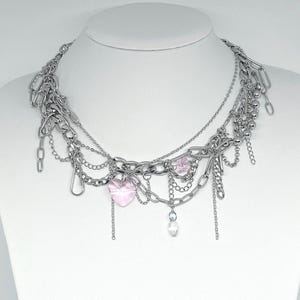 cute cyber y2k pastel pink beaded necklace with lots of chunky chain details