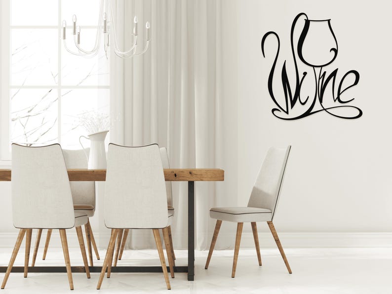May include: Black wall art featuring the word "Wine" stylized as a wine glass. The image is in a dining room setting with a wooden table, chairs, and a chandelier. The room has white curtains and a neutral color palette.