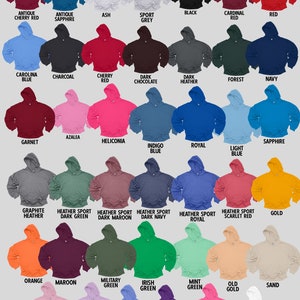 May include: A color chart of 36 different hoodie colors. The colors are arranged in rows and columns. The colors include antique cherry red, antique sapphire, ash, sport grey, black, cardinal red, red, carolina blue, charcoal, cherry red, dark chocolate, dark heather, forest, navy, garnet, azalea, heliconia, indigo blue, royal, light blue, sapphire, graphite heather, heather sport dark green, heather sport dark maroon, heather sport dark navy, heather sport royal, heather sport scarlet red, gold, orange, maroon, military green, irish green, mint green, old gold, sand, light pink, orchid, violet, purple, safety pink, and white.