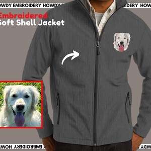 May include: A gray soft shell jacket with a zipper closure and a white embroidered dog on the left chest. The text "Embroidered Soft Shell Jacket" is written in red on the top left corner of the image.