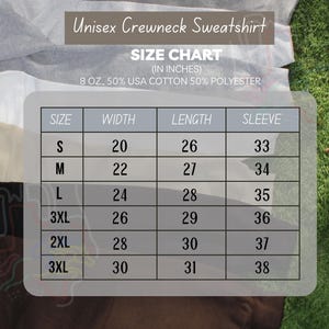 May include: Size chart for a unisex crewneck sweatshirt made of 50% USA cotton and 50% polyester. The chart shows the width, length, and sleeve length in inches for sizes S, M, L, 3XL, 2XL, and 3XL.
