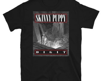 May include: Black t-shirt with a grayscale graphic. The text "SKINNY PUPPY" is in a red-outlined box above the image, and "DIGIT" is in a red-outlined box below. The graphic depicts a dark, industrial scene.