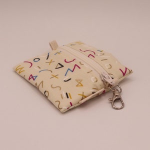 Mini pochette zippée - Pochette porte-clés pour pièces de monnaie ou écouteurs - Imprimé abstrait