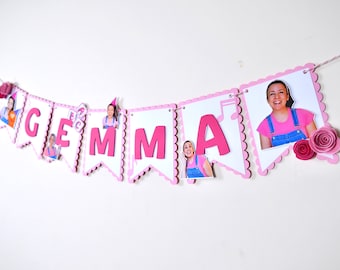 May include: Pink and white banner with the name "GEMMA" in large pink letters. Each letter has a photo of a person on it. The banner is decorated with pink flowers and a music note.