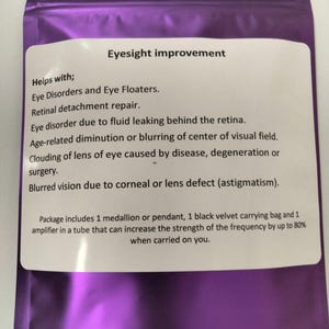 May include: Purple pouch with a white label that reads "Eyesight improvement" and lists various eye conditions that the product helps with. The product includes a medallion or pendant, a black velvet carrying bag, and an amplifier in a tube.