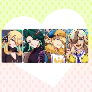 May include: A set of four rectangular art prints featuring stylized anime-style characters. The first shows a blonde character, the second a green-haired character, the third a blonde character in a cap, and the fourth a light-haired character.