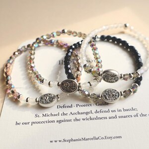 Four St Michael beaded stretch bracelets with silver saint medal centerpiece crystal glass beads and dainty spiritual design –Catholic guardian angel jewelry gift for women families of police officers first responders and military