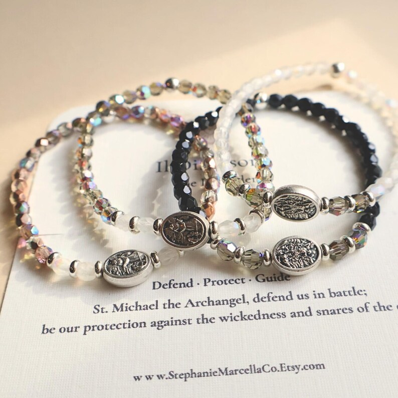 Four St Michael beaded stretch bracelets with silver saint medal centerpiece crystal glass beads and dainty spiritual design –Catholic guardian angel jewelry gift for women families of police officers first responders and military