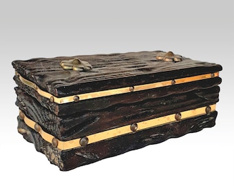 Vintage pirate treasure box made of solid burnt wood with brass decoration