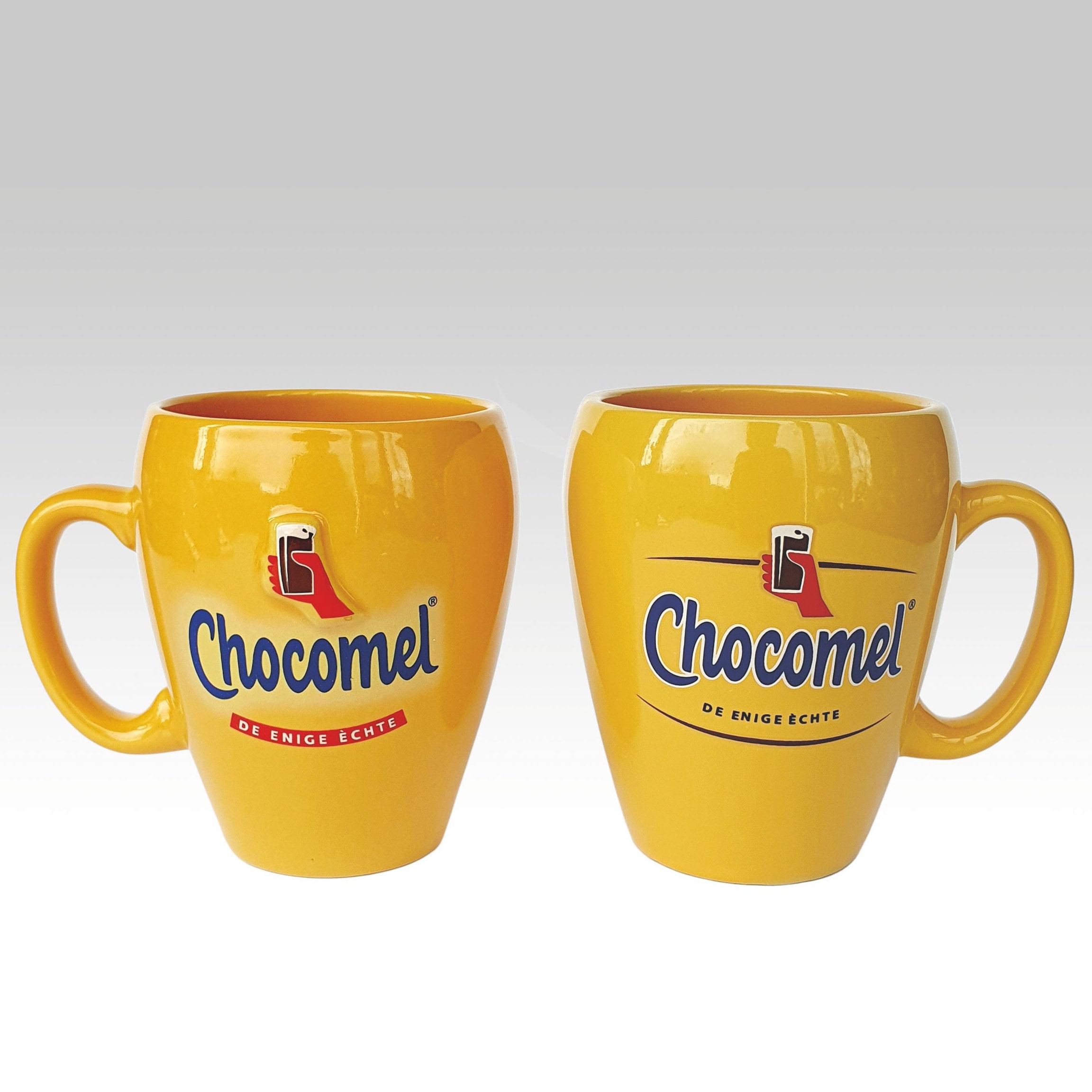 Orange cups or mugs Chocomel with handles for chocolate milk, various variations