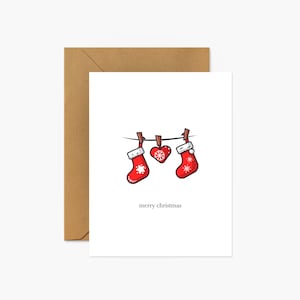 Stockings hanging from string Christmas Greeting Card