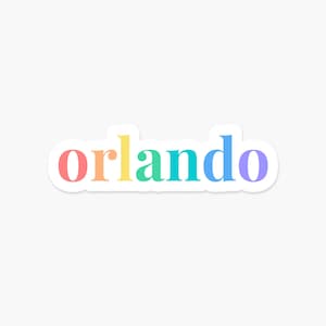 May include: A sticker with the word "orlando" written in rainbow colors. The letters are in a bold, sans-serif font.