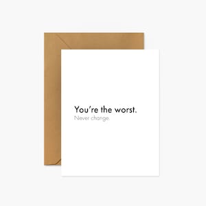 May include: A white card with the text "You're the worst. Never change." printed in black.