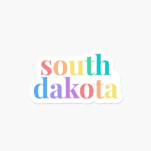 May include: A sticker with the words "south dakota" in rainbow colors. The letters are in a bold, sans-serif font.