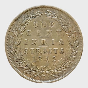May include: A silver coin from 1862 with the text "ONE CENT INDIA STRAITS" and the year. The coin is surrounded by a laurel wreath design.