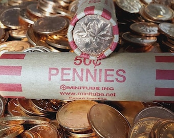 May include: A roll of 50¢ pennies with the text "50¢ PENNIES" printed in red. The roll is resting on a pile of loose pennies. The end of the roll shows a 1964 Canadian penny with a maple leaf design.