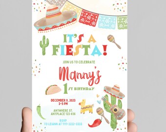 May include: A colorful invitation for a first birthday party with a fiesta theme. The invitation features a sombrero, a cactus, a maraca, a guitar, a taco, and a piñata. The text on the invitation reads "It's a Fiesta! Join us to celebrate Manny's 1st Birthday. December 9, 2023, 3-5 PM, Anywhere St., Anyplace 123 456. RSVP to Leiann at 1111-2222-3333."