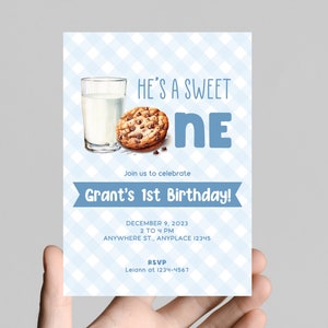 May include: A blue and white checkered invitation card with the text "He's a Sweet One" and a chocolate chip cookie and a glass of milk. The invitation is for Grant's 1st birthday party on December 9, 2023, from 2 to 4 PM at Anywhere St., Anyplace 12345. RSVP to Leiann at 1234-4567.