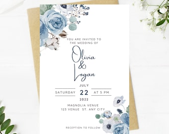 May include: A wedding invitation with blue watercolor flowers and greenery. The invitation reads "You are invited to the wedding of Olivia & Logan, Saturday, July 22, 2022 at 5 PM, Magnolia Venue, 123 Venue St., Any City, Reception to follow."