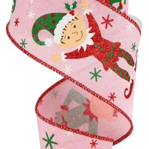 May include: Pink ribbon with a red border and a repeating pattern of elves with green hats and red and green outfits. The elves are holding candy canes and the ribbon has a snowflake and star pattern.