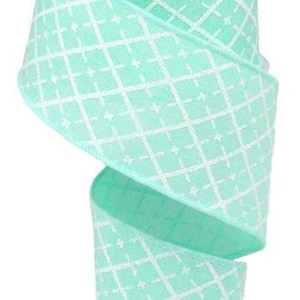 May include: A roll of 2.5 inch wide aqua blue wired ribbon with a white diamond pattern.