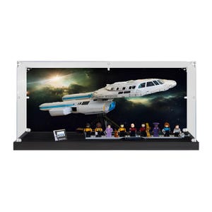 May include: A clear acrylic display case containing a white and blue Star Trek starship model mounted on a stand. Inside the case, nine small character figurines stand on a black base in front of a space-themed backdrop with a bright star.
