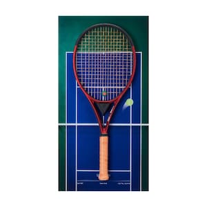 May include: A red tennis racket with a black frame and a light tan grip, featuring a Wilson logo on the strings. The racket is positioned over a graphic of a blue tennis court with white lines and a small yellow tennis ball in motion.