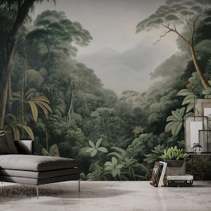May include: A detailed mural depicting a lush, green rainforest scene with dense foliage, trees, and a misty mountain backdrop. The artwork features a variety of plants and a dark, moody colour palette. A grey sectional sofa and side table are in the foreground.