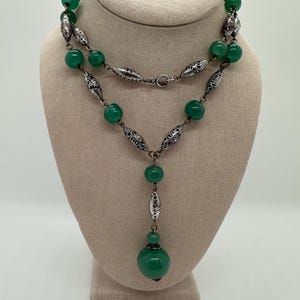 Vintage green poured glass bead and silver tone ornate beaded necklace
