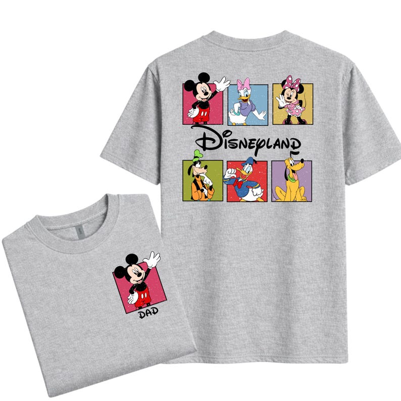 May include: Two gray t-shirts. One shirt has a small Mickey Mouse graphic with the word "DAD" on the front. The other shirt has a Disneyland graphic on the back with Mickey, Daisy, Minnie, Goofy, Donald, and Pluto.