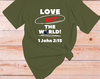 May include: A green t-shirt with the text "LOVE NOT THE WORLD! 1 John 2:15" in white. The word "NOT" is circled in red.