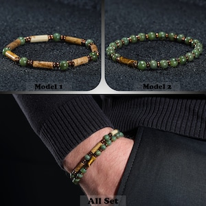 A bracelet with 6mm jade stone and yellow hematite stone on a black background, which can be bought as a gift for the boyfriend