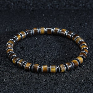 Unveil his unique charm with the Mens Certified Tigers Eye & Hematite Bracelet. Exquisite accessories that mirror his individuality.