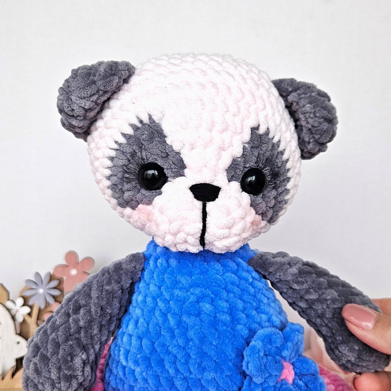 Close-up of the plush panda face and crochet texture