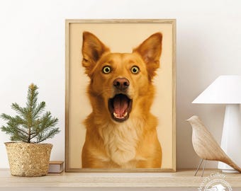 May include: A framed print featuring a surprised-looking dog with its mouth wide open. The dog has golden-brown fur, large ears, and wide, green eyes. The print is in a wooden frame and sits on a shelf with a small potted evergreen tree and a decorative bird.