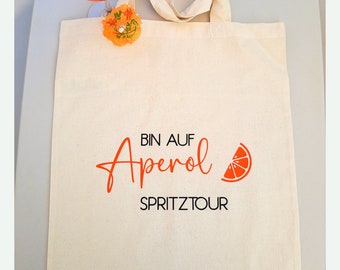 Bio Baumwolltasche Aperol Spritztour, Stoffbeutel Aperol Spritz Tour, Geschenktasche für Getränke, Aperol Spruch in schwarz & orange