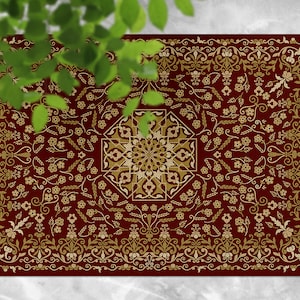 May include: A red and gold patterned rug with a geometric design in the center. The rug has a border of intricate floral patterns.