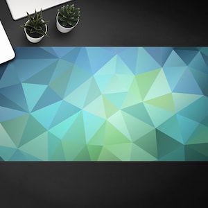 Optische illusie Groenblauwe driehoeken bureauonderlegger, blauw toetsenbordkussen, groen bureaubladvloeipapier, geometrische bureaubeschermmat