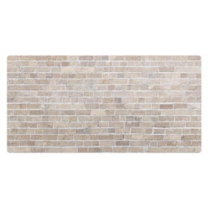 Può includere: Un primo piano di un muro di mattoni di colore beige chiaro. I mattoni sono disposti a spina di pesce, creando una superficie testurizzata.