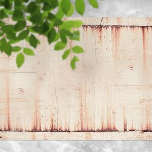 May include: A white, rectangular sign with a distressed, rusty border. The sign is made of wood and has a weathered, vintage look.