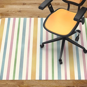 May include: A colorful striped office chair mat with pastel blue, green, pink, and yellow stripes on a white background. The mat is designed to protect floors from chair wheels.