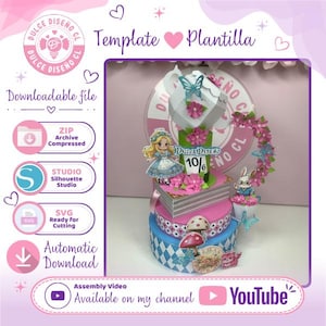 May include: A multi-tiered paper craft centrepiece featuring a character with blonde hair, a white rabbit, a top hat with a 10/6 tag, pink flowers, blue butterflies, and mushrooms. The structure includes stacked book-shaped layers and patterned bases.