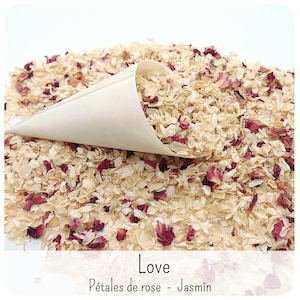 May include: A light-coloured paper cone filled with a mixture of dried cream-coloured jasmine blossoms and deep pink rose petals. The text "Love" and "P&eacute;tales de rose - Jasmin" is printed at the bottom of the image in a simple black font.