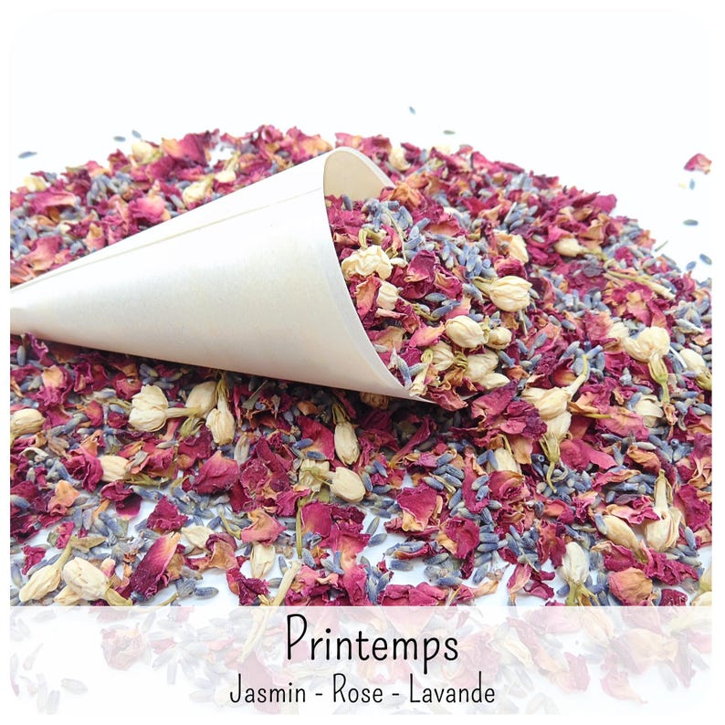 May include: A cream-coloured paper cone filled with a mixture of dried pink rose petals, purple lavender buds, and small white jasmine flowers. The text "Printemps" and "Jasmin - Rose - Lavande" is printed in black at the bottom of the image.