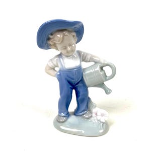 Hand-Painted Ceramic Boy Figurine: Vintage Watering Can Decor